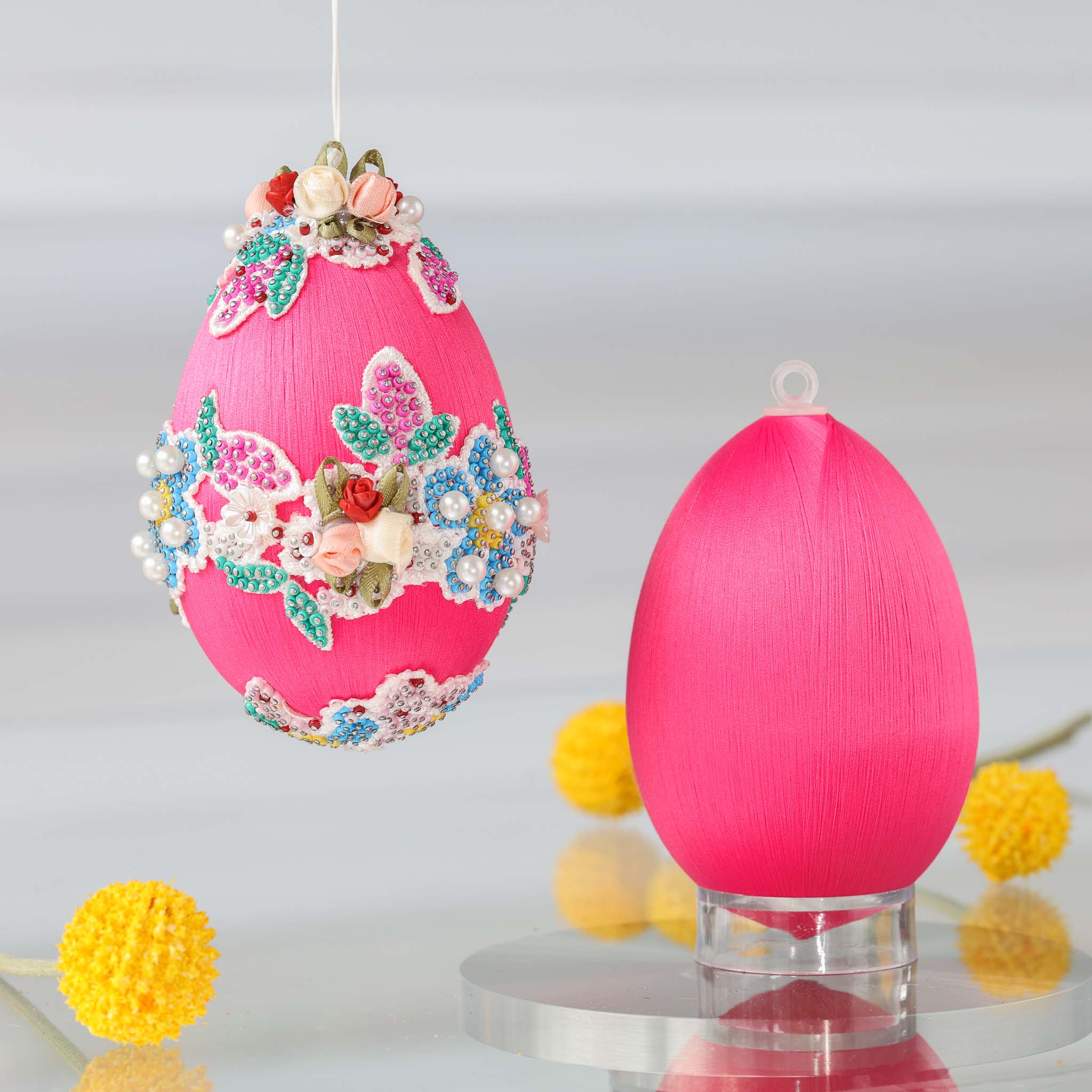 Large pink satin Easter egg push pin ornament kit with floral embellishments on a white background and a reflective surface by Whim5seasons. (Deep Pink)