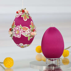 Decorative purple 4" Easter egg  kit for a push pin ornament kit with floral embellishments on a white background and a reflective surface by Whim5seasons. (Purple)