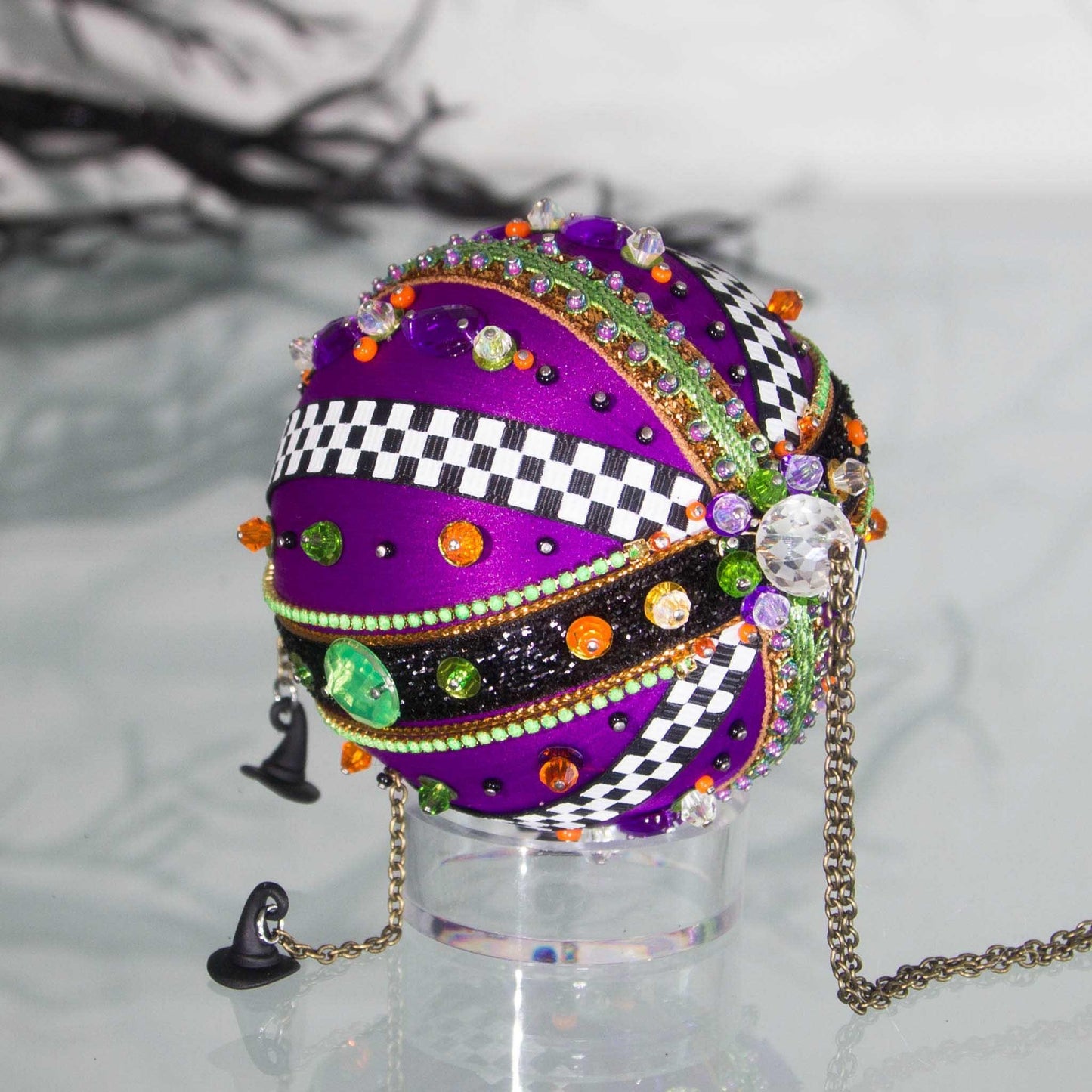 Top large bead detail of Halloween handmade ornament adorned with mini witch hat charms. (Indigo)