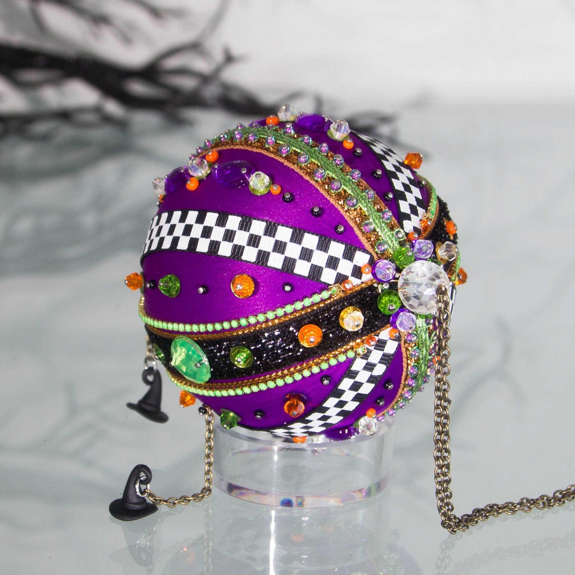 Top large bead detail of Halloween handmade ornament adorned with mini witch hat charms. (Indigo)