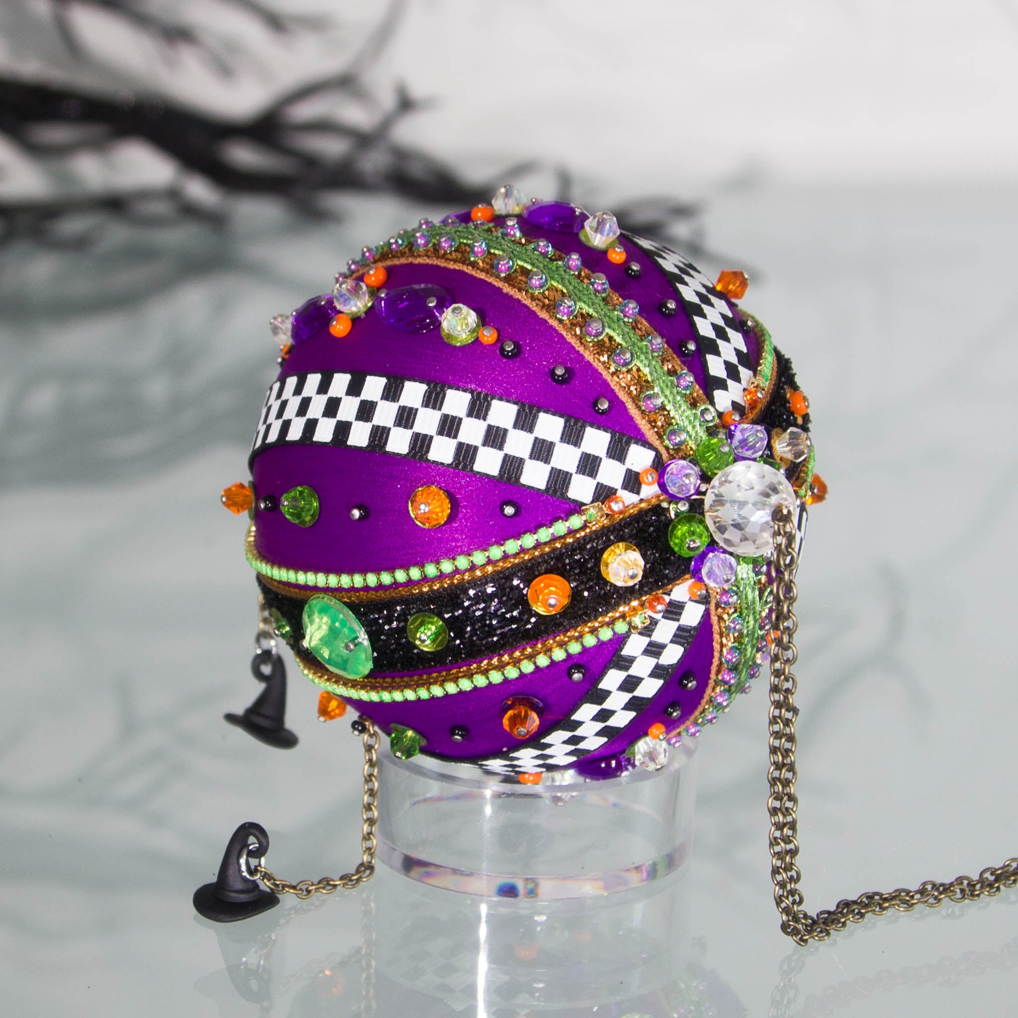 Top large bead detail of Halloween handmade ornament adorned with mini witch hat charms. (Indigo)