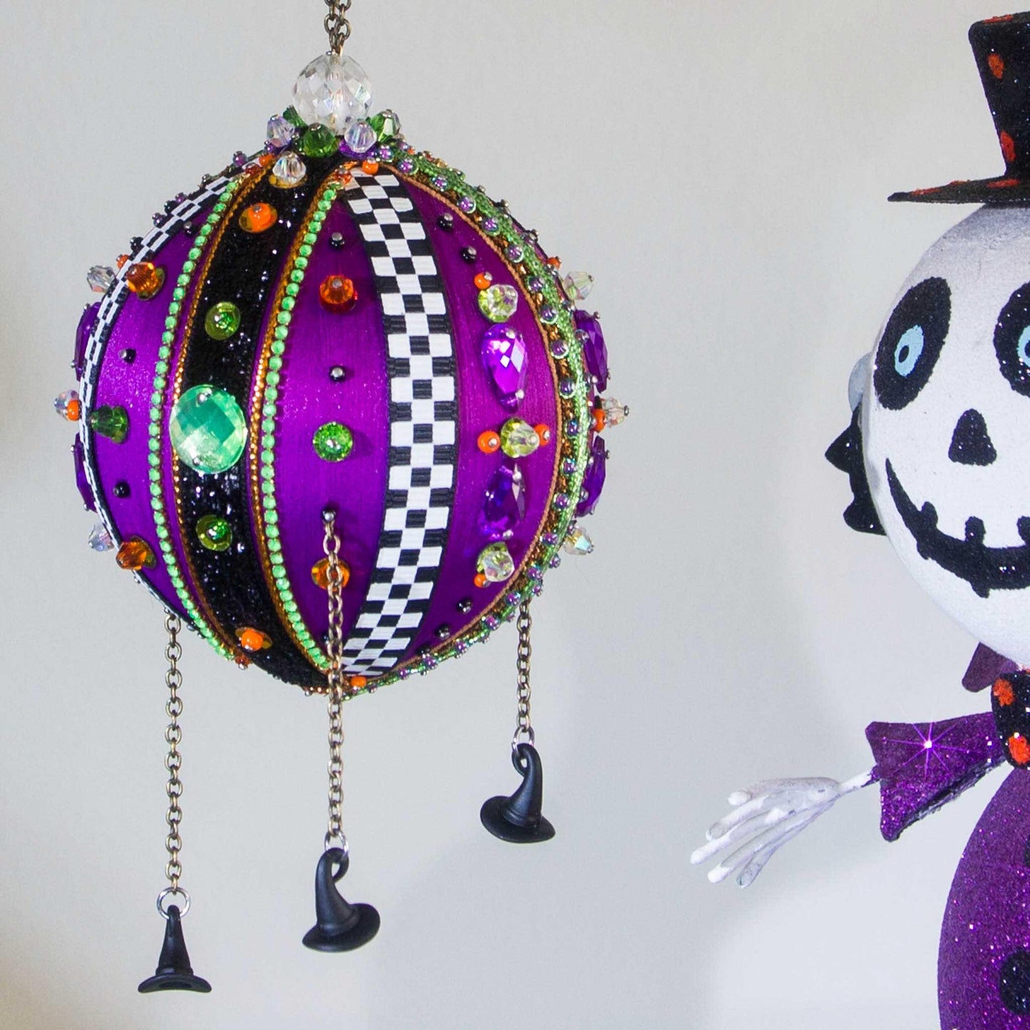 Bright handmade Halloween ornament  by Whim5seasons embellished with rhinestones, checkered trims, and beads. (Indigo)