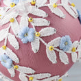 Load image into Gallery viewer, A close-up picture of a handmade Christmas or Easter beaded push pin Ornament embellished with small blue embroidered flowers, white trim, and yellow seed beads. (Pale Violet Red)
