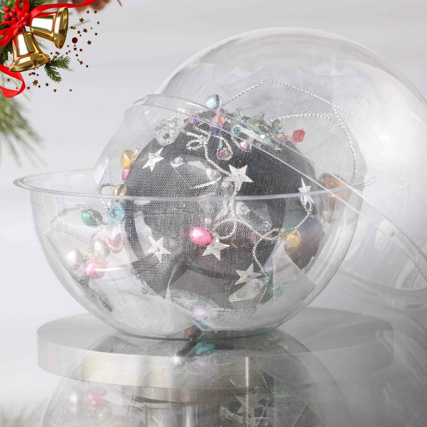 Handmade completed Christmas push pin satin ornament with silver star sequins inside a round clear storage container, with a pinecone on a light background.