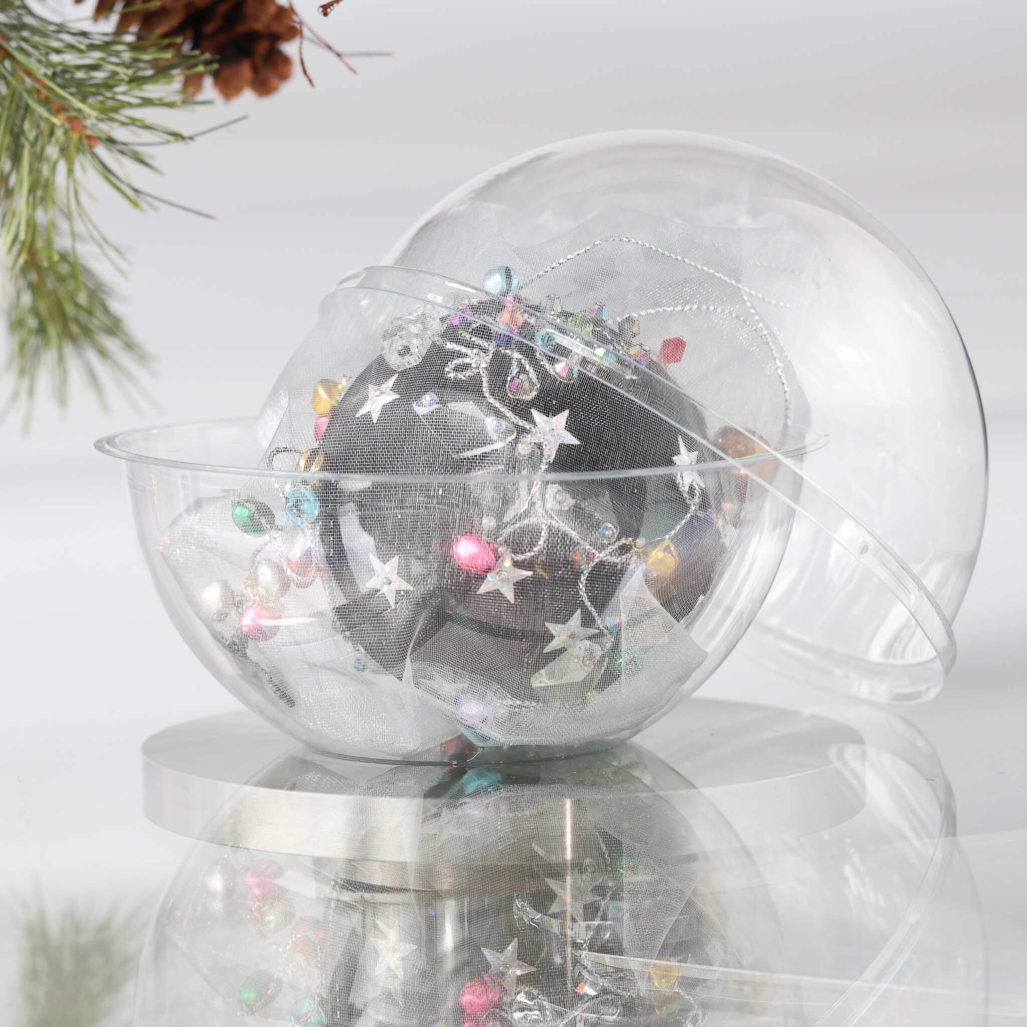 Handmade completed Christmas push pin satin ornament with silver stgar sequins inside a round clear storage container, with a pinecone on a light background.