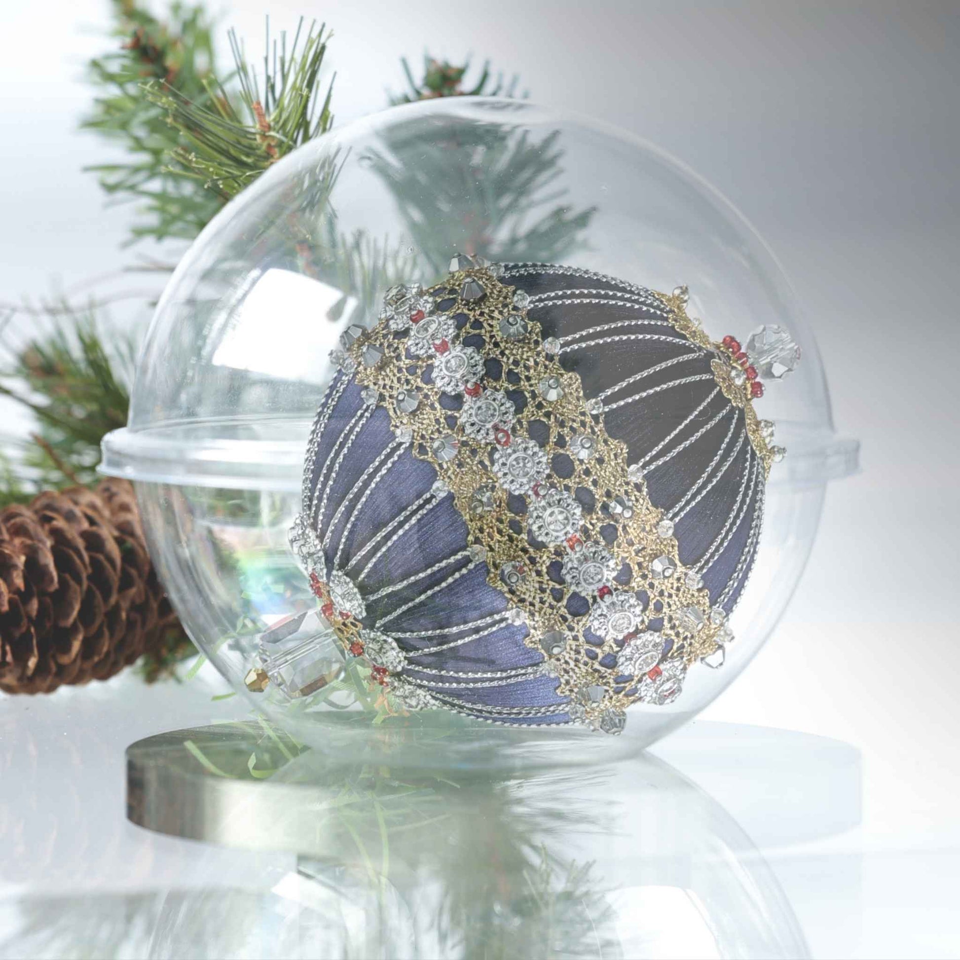 Handmade satin push pin ornament in a clear storage container, richly embellished with rhinestones, gold and silver trim, rows of silver beads, and large clear beads by Whim5seasons.