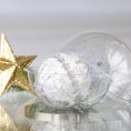 Load image into Gallery viewer, Completed Handmade Christmas Push Pin Ornament in a bright white color with silver star design in a storage container set against a background with a star and holiday greenery. (White)
