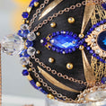 Load image into Gallery viewer, Close-up detail of a black handcrafted satin Christmas ornament with blue and clear beads pinned to the satin foam core with dressmaker pins by Whim5seasons. (Black)
