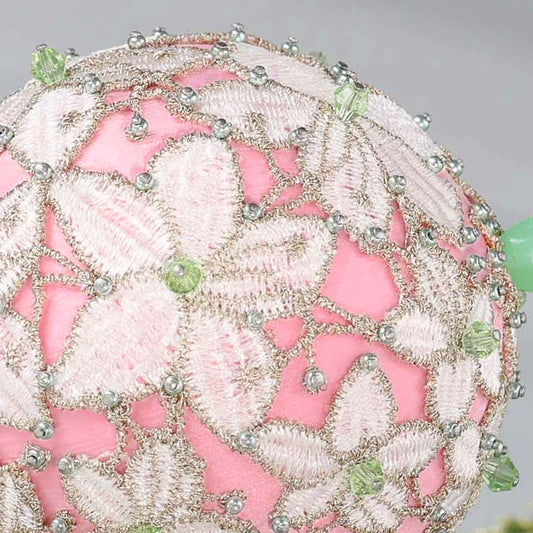 Close-up of a decorative pink push pin satin ball showing small beads pinned with dressmaker pins by Whim5seasons.