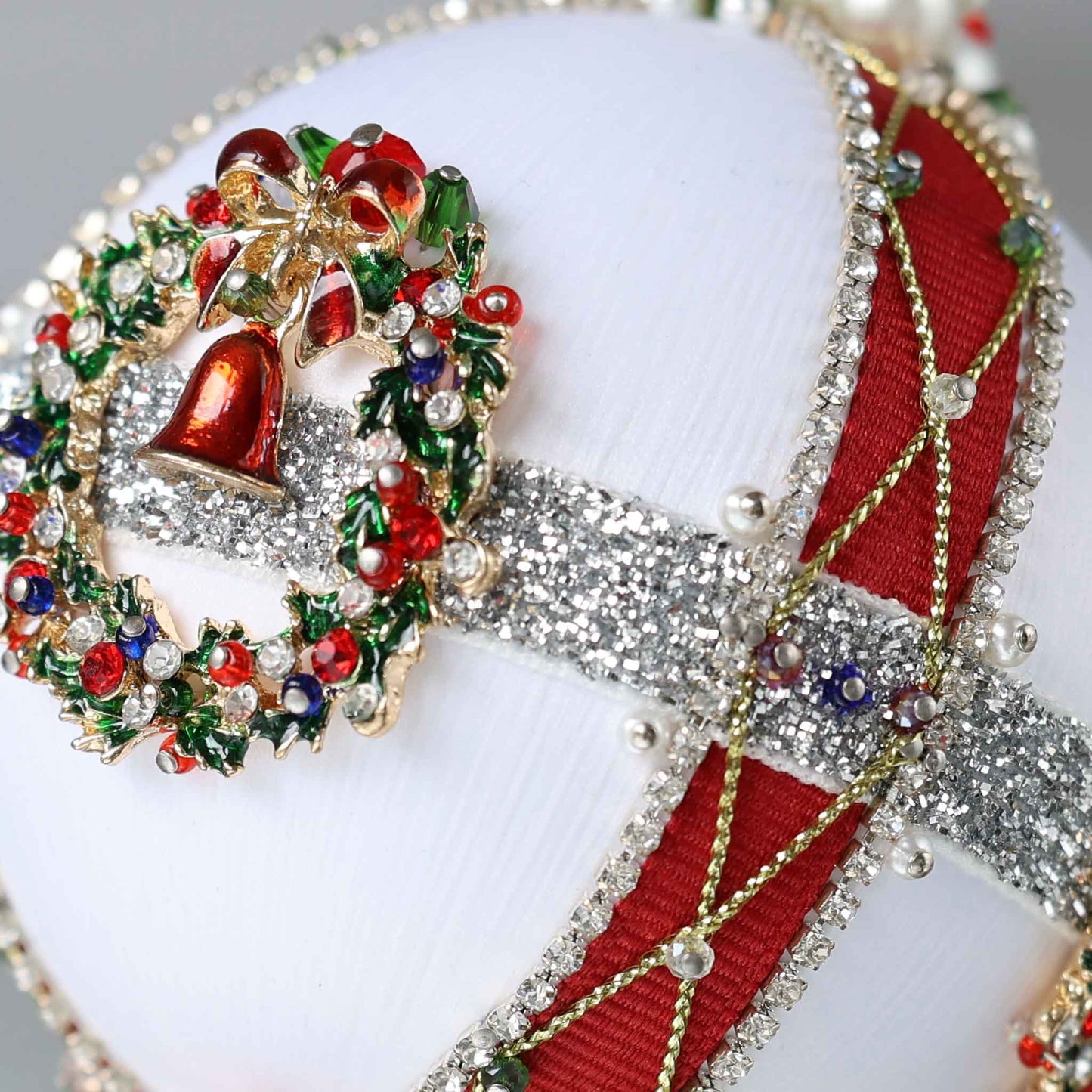 Close-up of a handmade Christmas beaded push pin satin ball showing small pearl bead pinned with dressmaker pins by Whim5seasons.