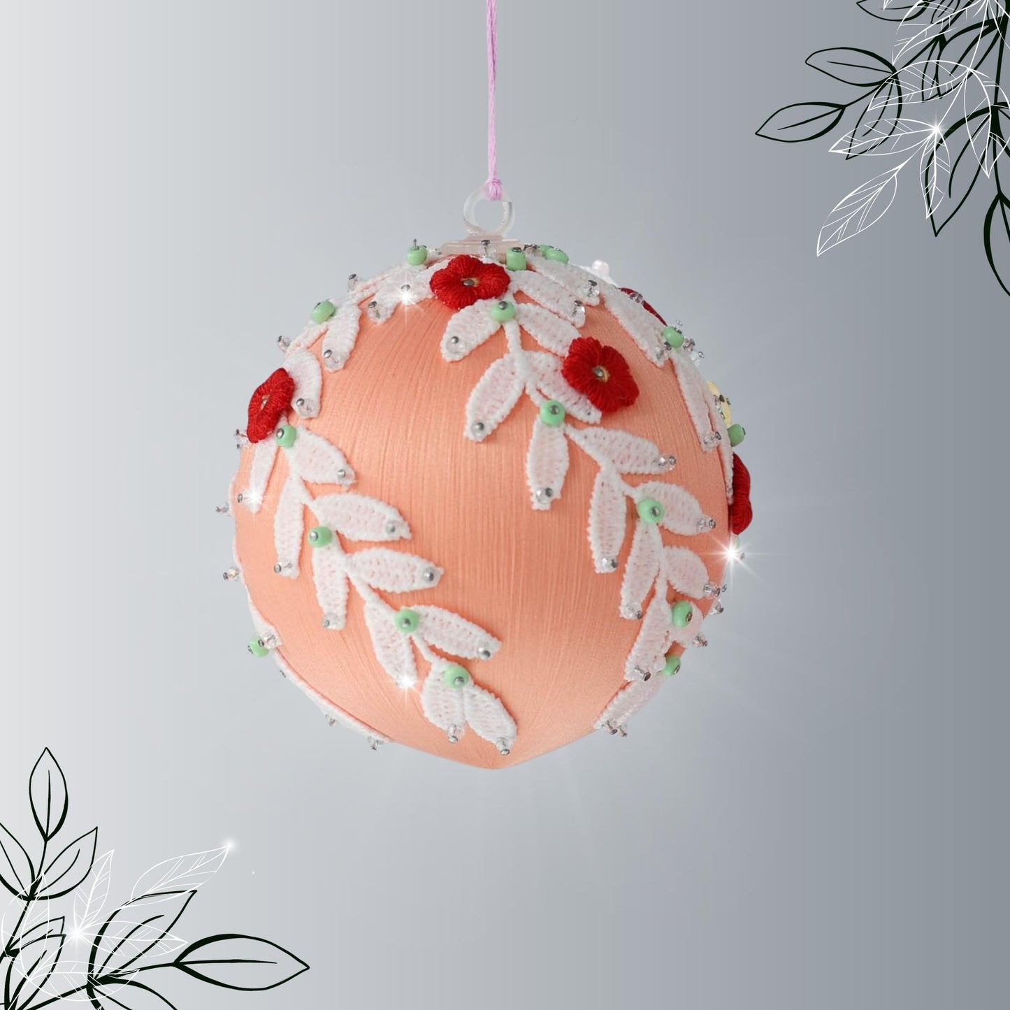 Handmade Christmas or Easter Beaded push pin Ornament Ball embellished with small red embroidered flowers, white trim, and beads hanging from a holiday branch by Whim5seasons.