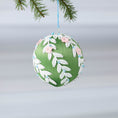 Load image into Gallery viewer, Handmade olive green Christmas or Easter Beaded push pin Ornament Ball embellished with flowers, white trim, and beads hanging on a blue string. (Olive)
