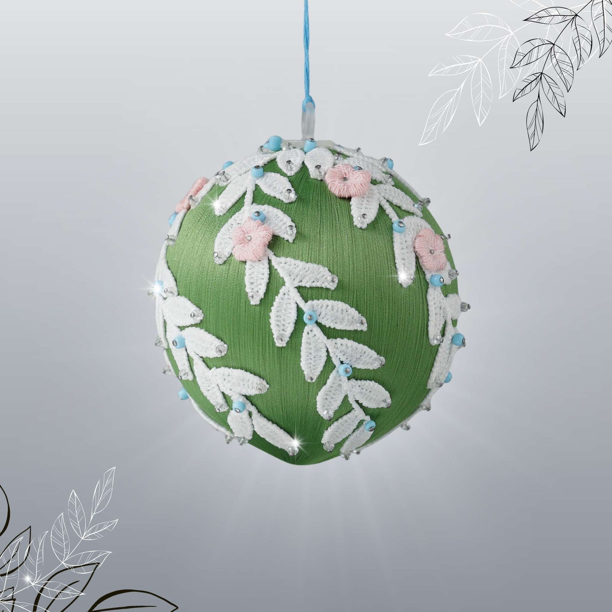 Handmade olive green Christmas or Easter Beaded push pin Ornament Ball embellished with flowers, white trim, and beads hanging on a blue string by Whim5seasons.