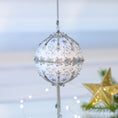 Load image into Gallery viewer, Handmade Christmas push Pin Ornament New Year Star is a white satin ball embellished with silver sequins and rhinestone chains set against a light background with a gold star. (White)

