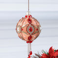 Load image into Gallery viewer, Handmade ornament in a light coral color featuring stunning alloy and crystal framed pearl cameos, rhinestone chain, rose gold chain, hanging on a light gray background by Whim5seasons. (Coral)
