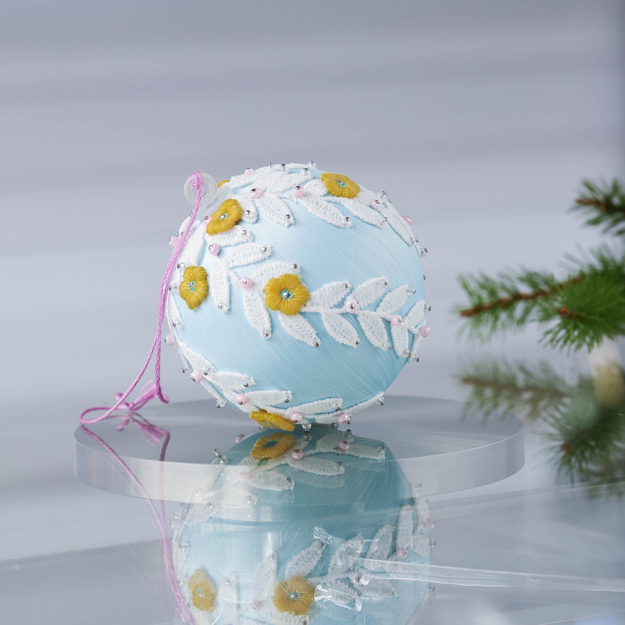 Handmade Retro Style Christmas ornament  - a satin push pin core as a base, embellished with white lace trim, yellow embroidered flowers, and pink and clear beads. (Light Blue)