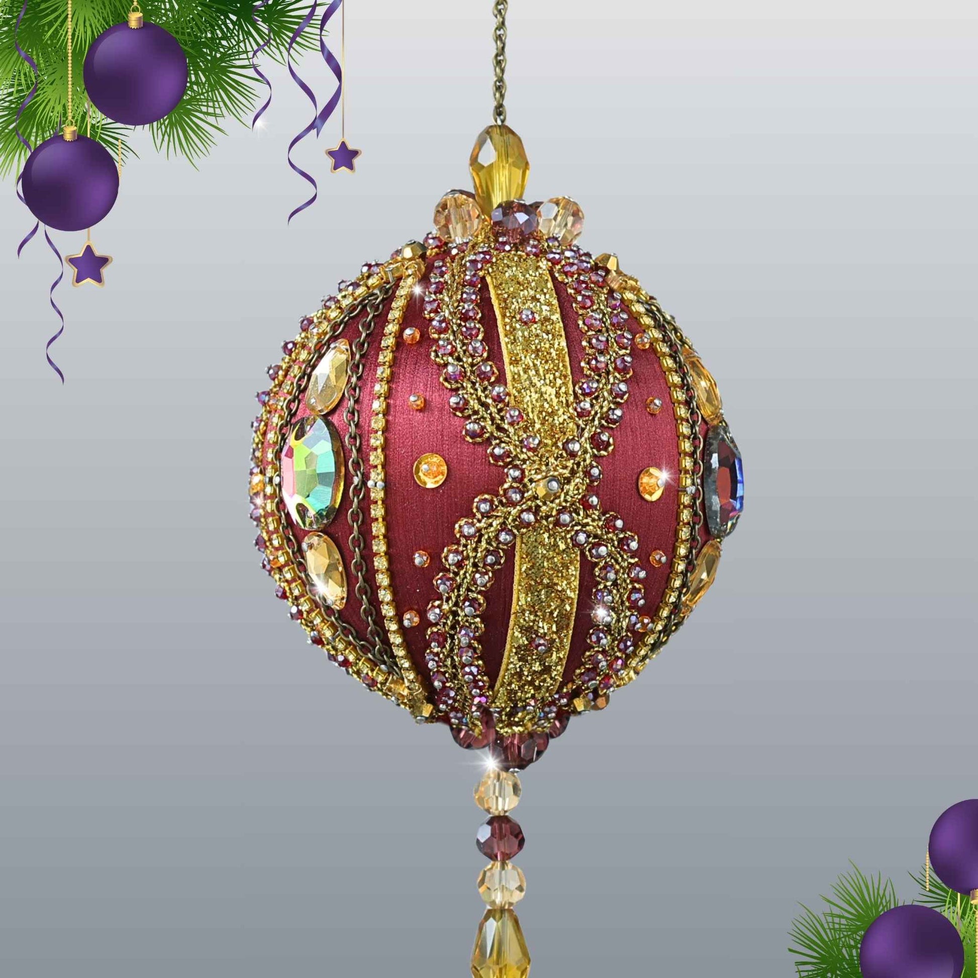 Handmade Satin Ornament by Whim5seasons, a decoration embellished with glass rhinestones, gold braided trim, and crystal beads, with a glass bead tassel on a light gray background.
