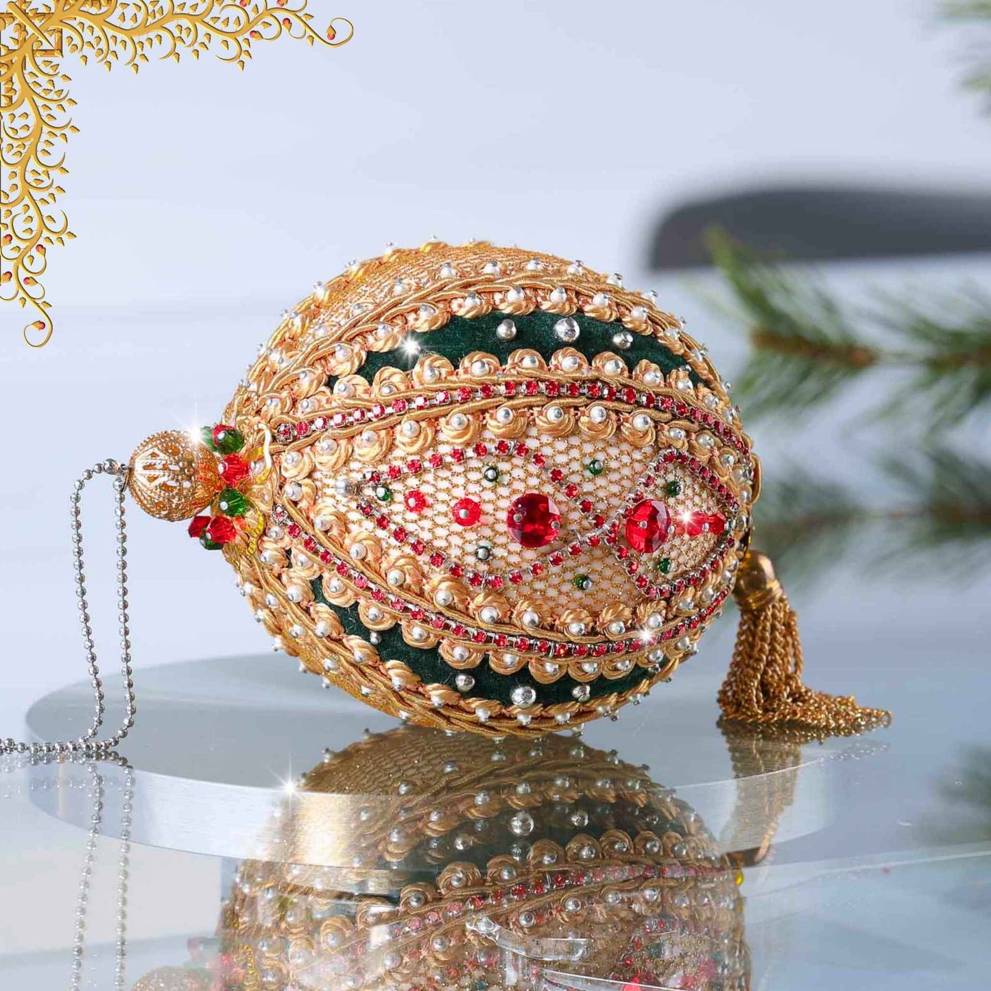 Handmade gold and green satin push pin ornament featuring a large filigree gold bead on the top with a Christmas branch and pinecones in the background by Whim5seasons.