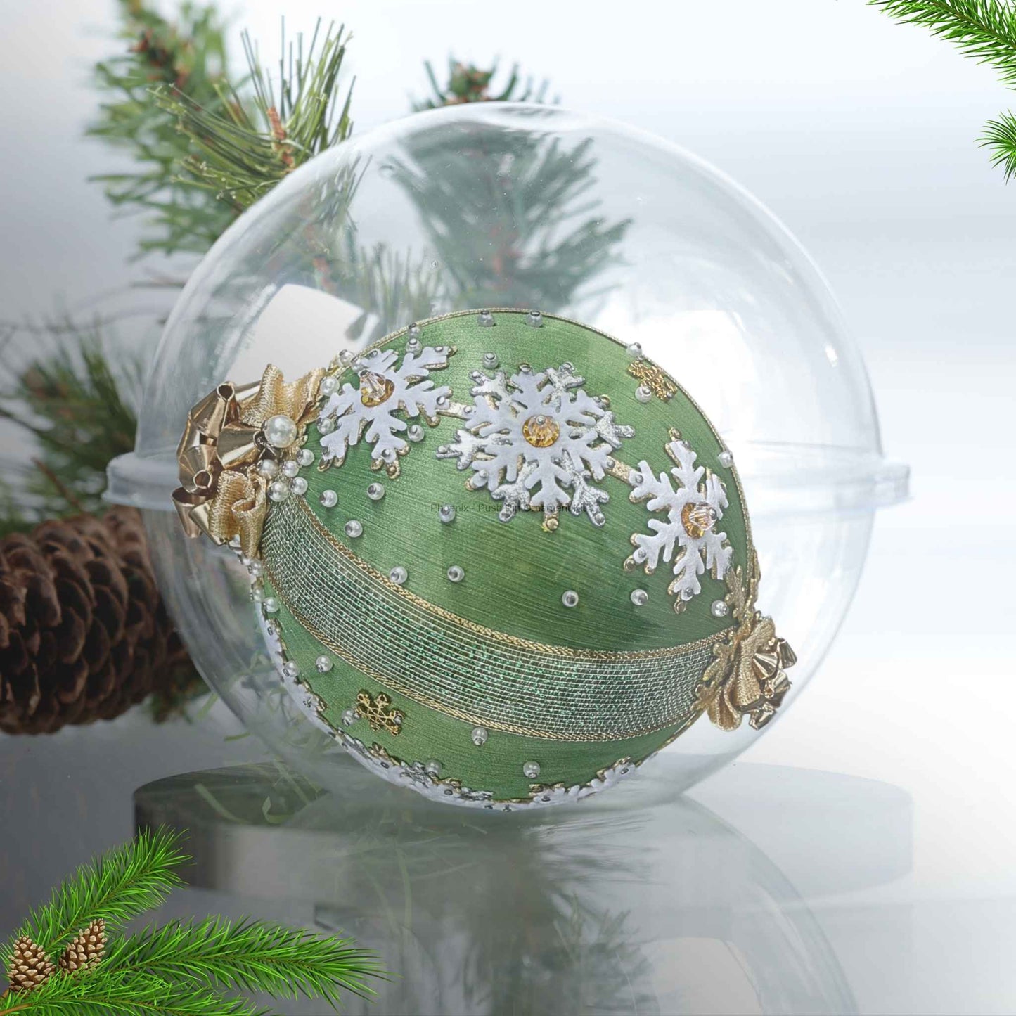 A satin handcrafted olive green push pin Christmas ornament with gold trims and gift bow charms applied to the satin foam core with dressmaker pins by Whim5seasons.