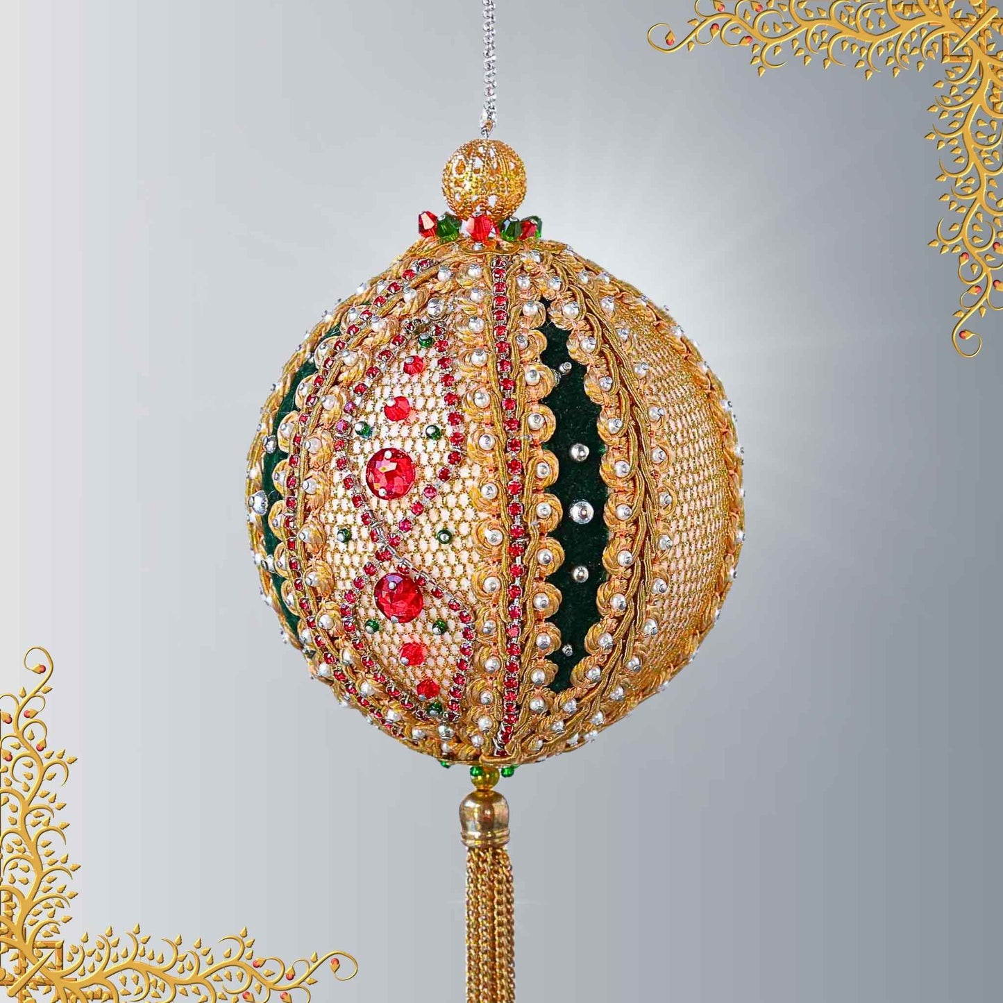 Handmade gold beaded push pin ornament featuring small pearls, red rhinestones, and a gold chain tassel, hanging on a chain in front of light gray background by Whim5seasons.
