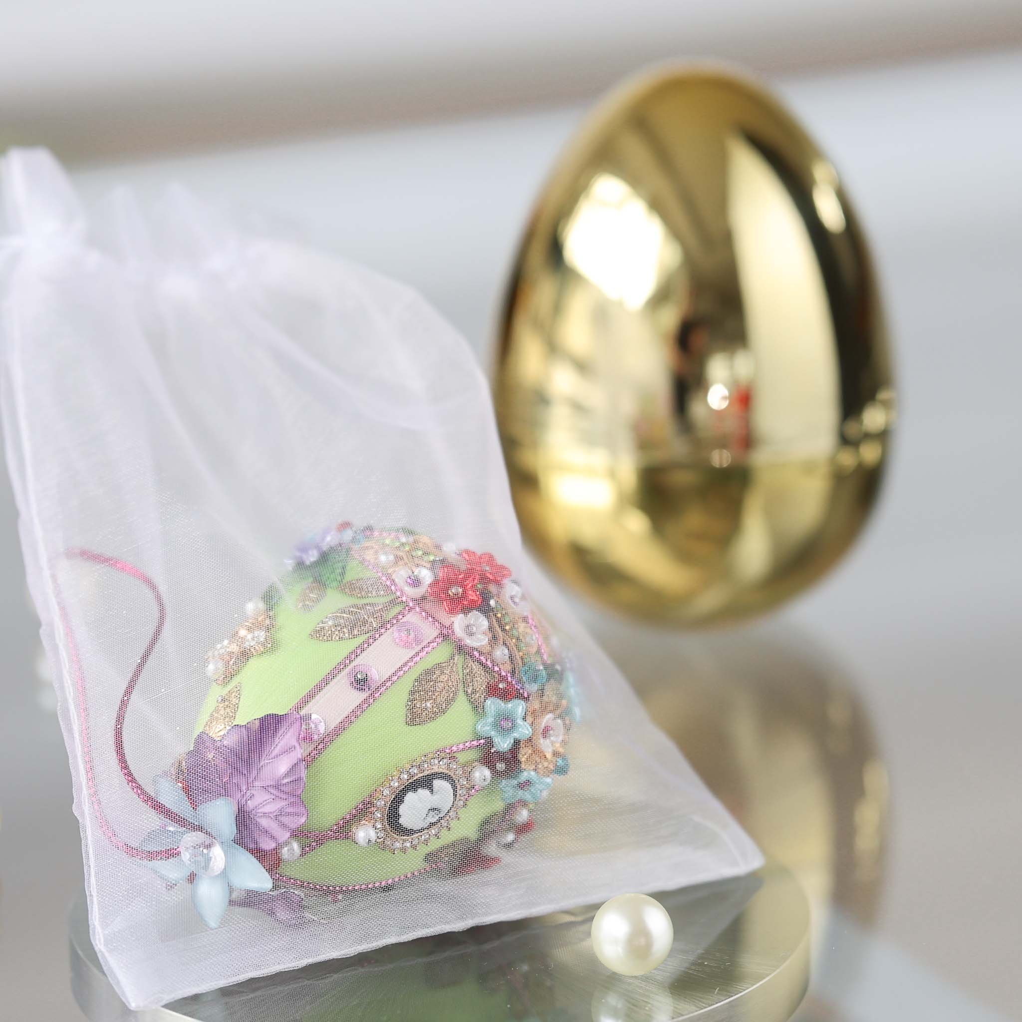 Gold egg-shaped storage container with a handmade push pin Easter Faberge style ornament in organza nag by Whim5seasons. (Lime).