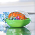 Load image into Gallery viewer, Handmade Easter Egg - a completed push pin ornament, orange with red rhinestones and colorful flowers inside a green storage container on a reflective surface.
