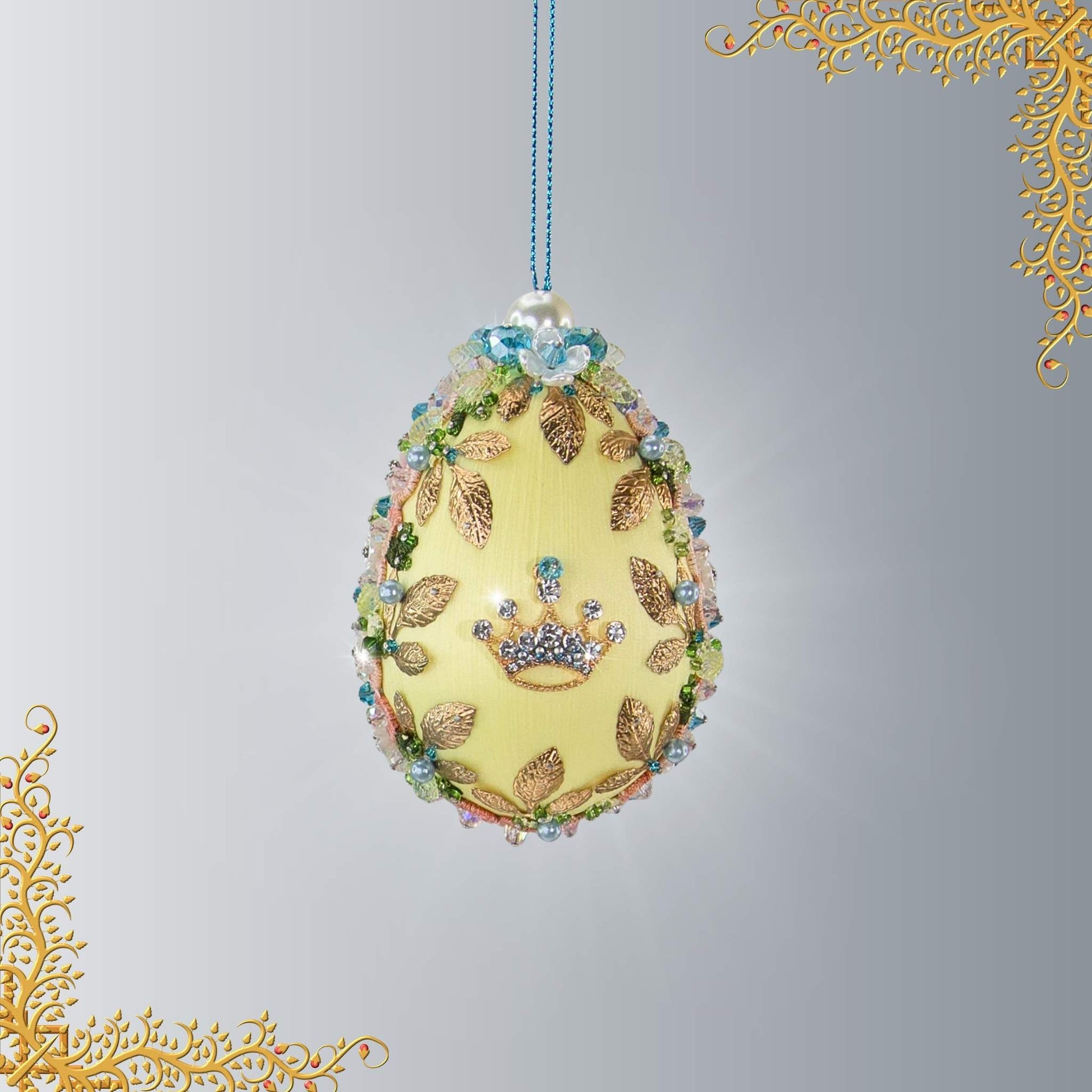 Handmade Easter Egg Beaded Ornament in yellow, embellished with flowers, gold leaves, crown charm, floral trim, and crystal beads by Whim5seasons.