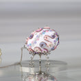 Load image into Gallery viewer, Handmade Easter Push Pin Ornament embellished with pink flowers, beads, and gold metallic trim on a silver stand against a light gray background by Whim5seasons.
