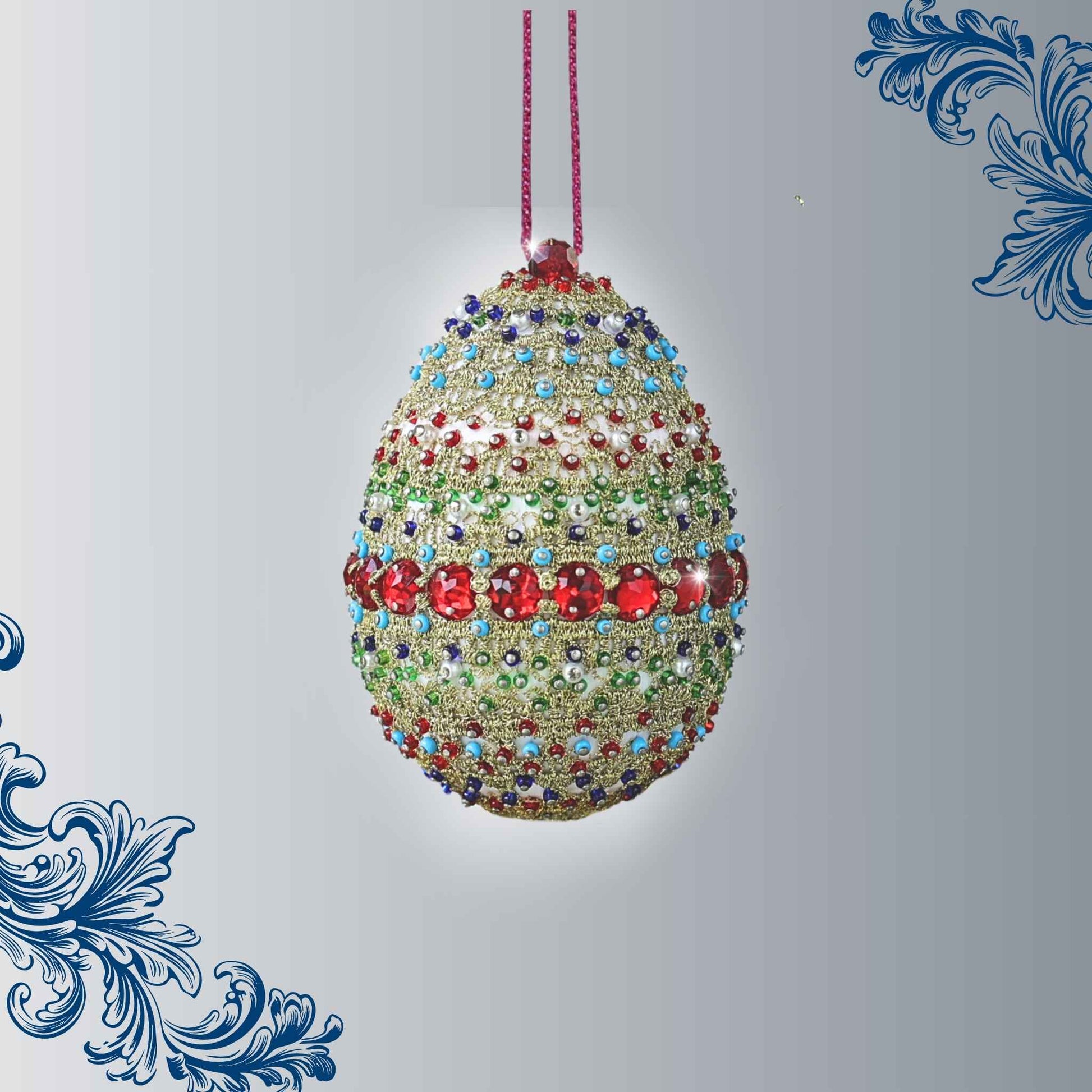 A complete handmade Easter Egg Ornament, push pin method using premium  satin  gold egg shaped core, bead embellishments, gold metallic trim, and a hundreds of seed beads by Whim5seasons. 