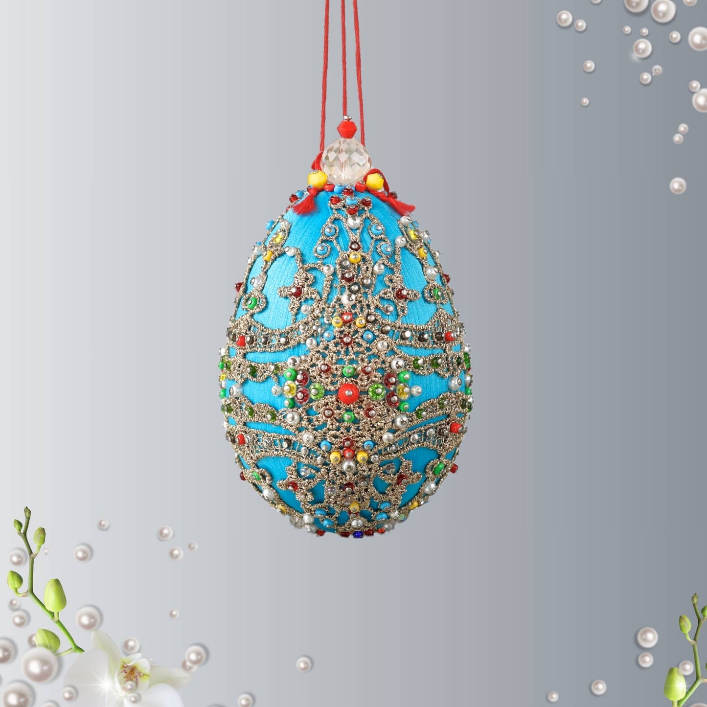 Handmade sequin & beaded Faberge style easter egg made with push pin technique featuring rich sky blue color, rose gold lace, and hundreds of seed beads by Whim5seasons.