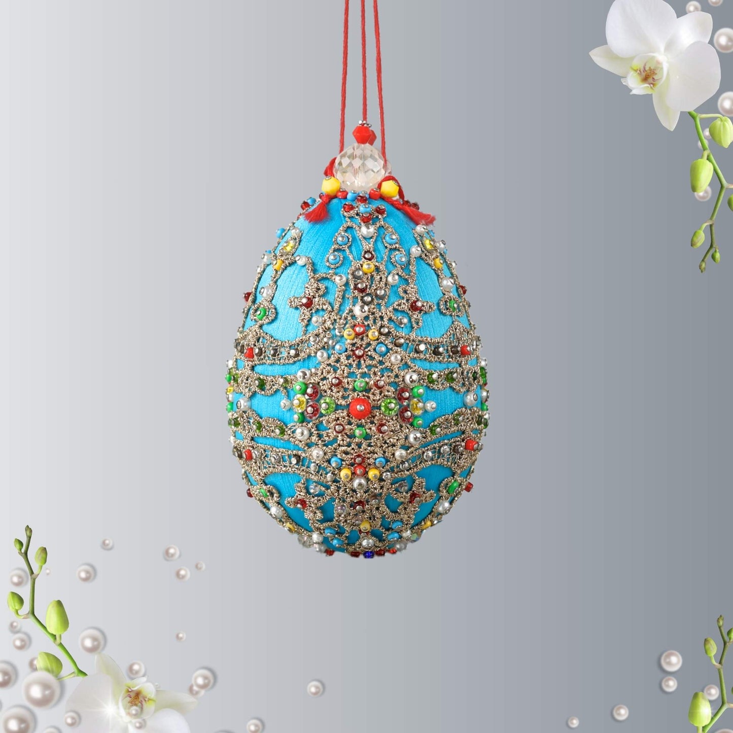 Handmade Easter Egg Ornament was completed by push pin method using premium  satin  sky blue egg shaped core, beads, embellishments, and metallic trim by Whim5seasons.