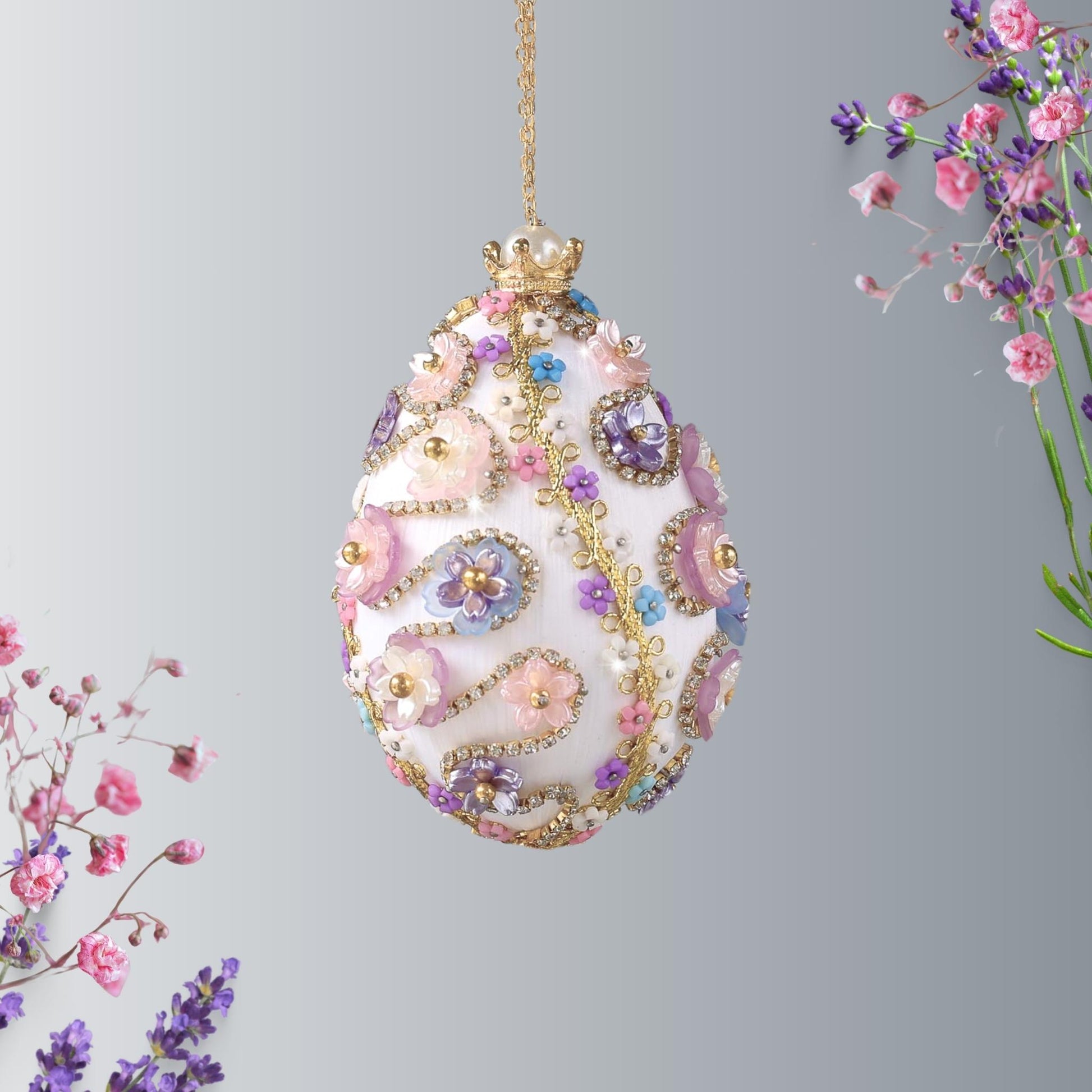 A complete handmade Easter Egg Ornament, push pin method using premium  satin  gold egg shaped core, bead embellishments, gold trim, and a crown charm by Whim5seasons. 