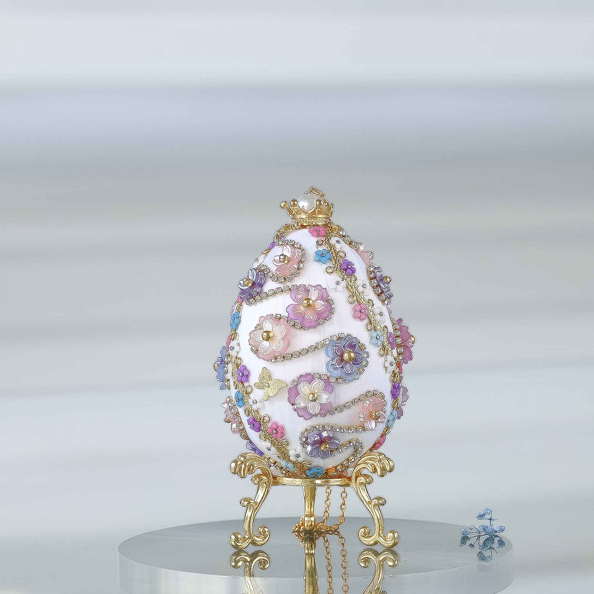 A complete handmade Easter Egg Ornament, push pin method using premium  satin  gold egg shaped core, bead embellishments, gold trim, and a crown charm by Whim5seasons. 