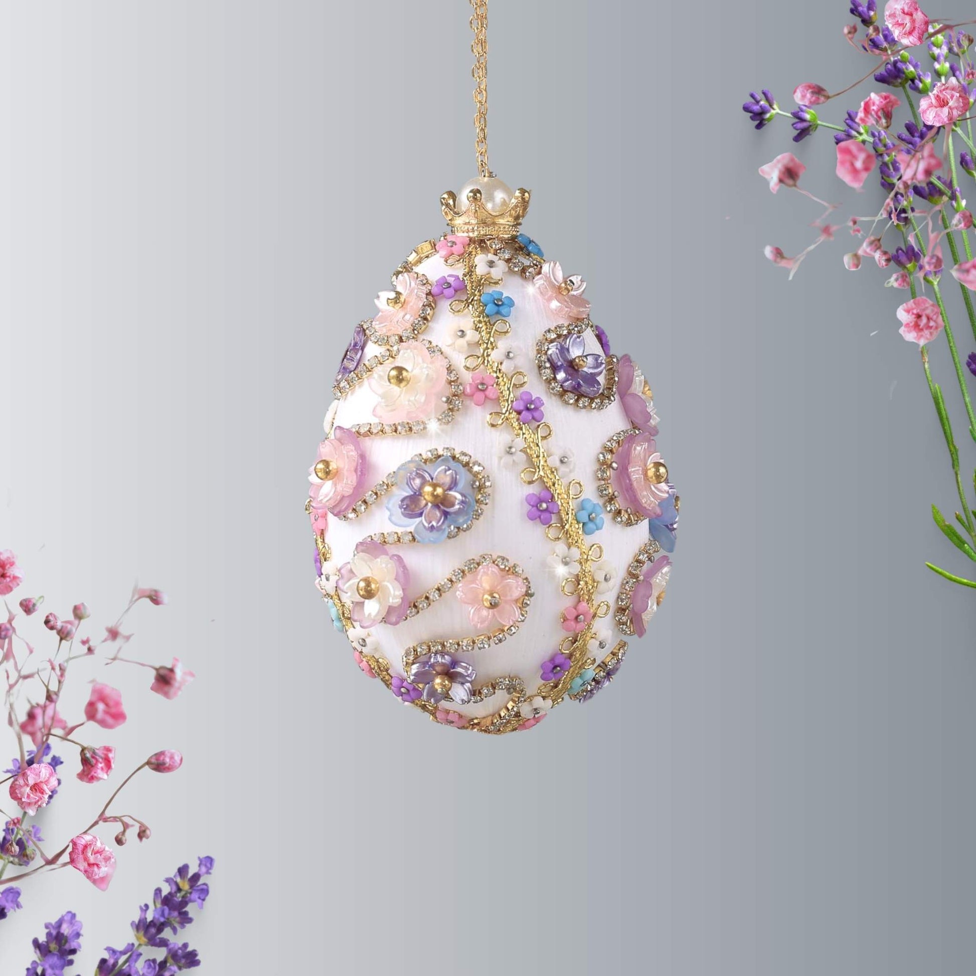 A complete handmade Easter Egg Ornament, push pin method using premium  satin  gold egg shaped core, bead embellishments, silver trim, and a crown charm by Whim5seasons. 