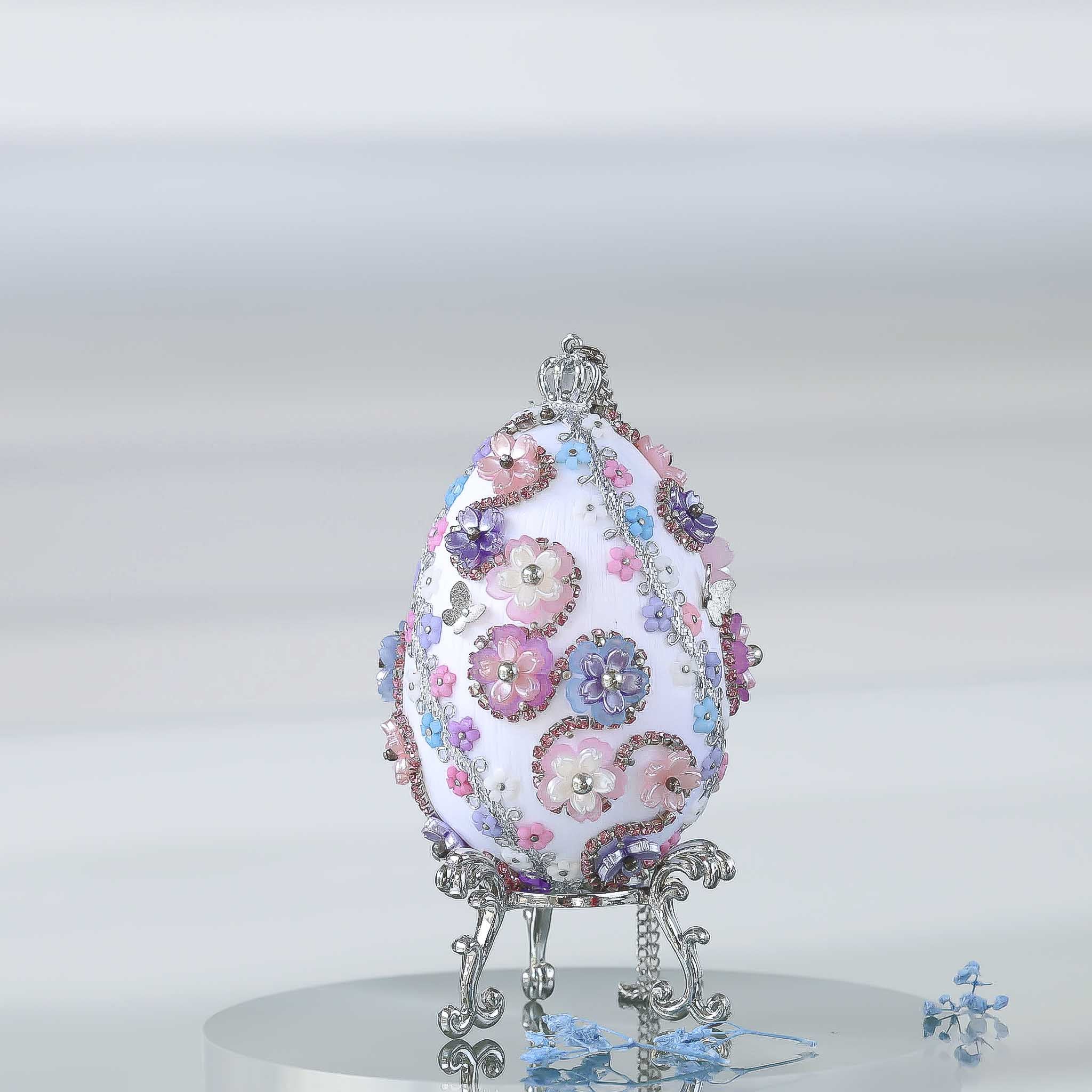 A complete handmade Easter Egg Ornament, push pin method using premium  satin  gold egg shaped core, bead embellishments, silver trim, and a crown charm by Whim5seasons. 