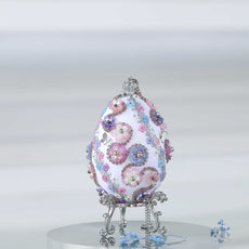 A complete handmade Easter Egg Ornament, push pin method using premium  satin  gold egg shaped core, bead embellishments, silver trim, and a crown charm by Whim5seasons. 