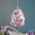 Load image into Gallery viewer, Beaded Push Pin Easter Egg Ornament hanging on a silver chain embellished with pink flowers on a blue background by Whim5seasons. (Silver)
