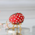 Load image into Gallery viewer, Handmade Easter Push Pin Ornament embellished with crystals, beads, and metallic trim on a gold stand against a light gray background. (Dark Red).
