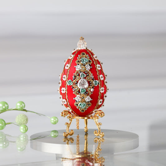 Luxurious handmade push pin Easter Egg in red on a gold stand set against a light background featuring gold, deep red, and silver colors. (Dark Red)