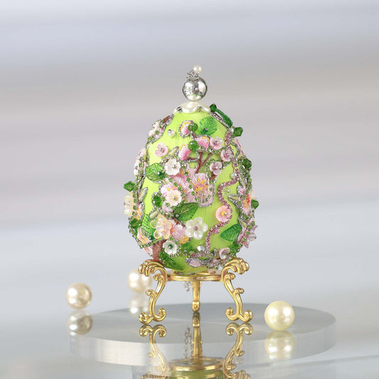 Luxurious handmade push pin Easter Egg on a gold stand with large pearls set against a light background featuring gold, pink, and green colors Whim5seasons. (Dark Red)