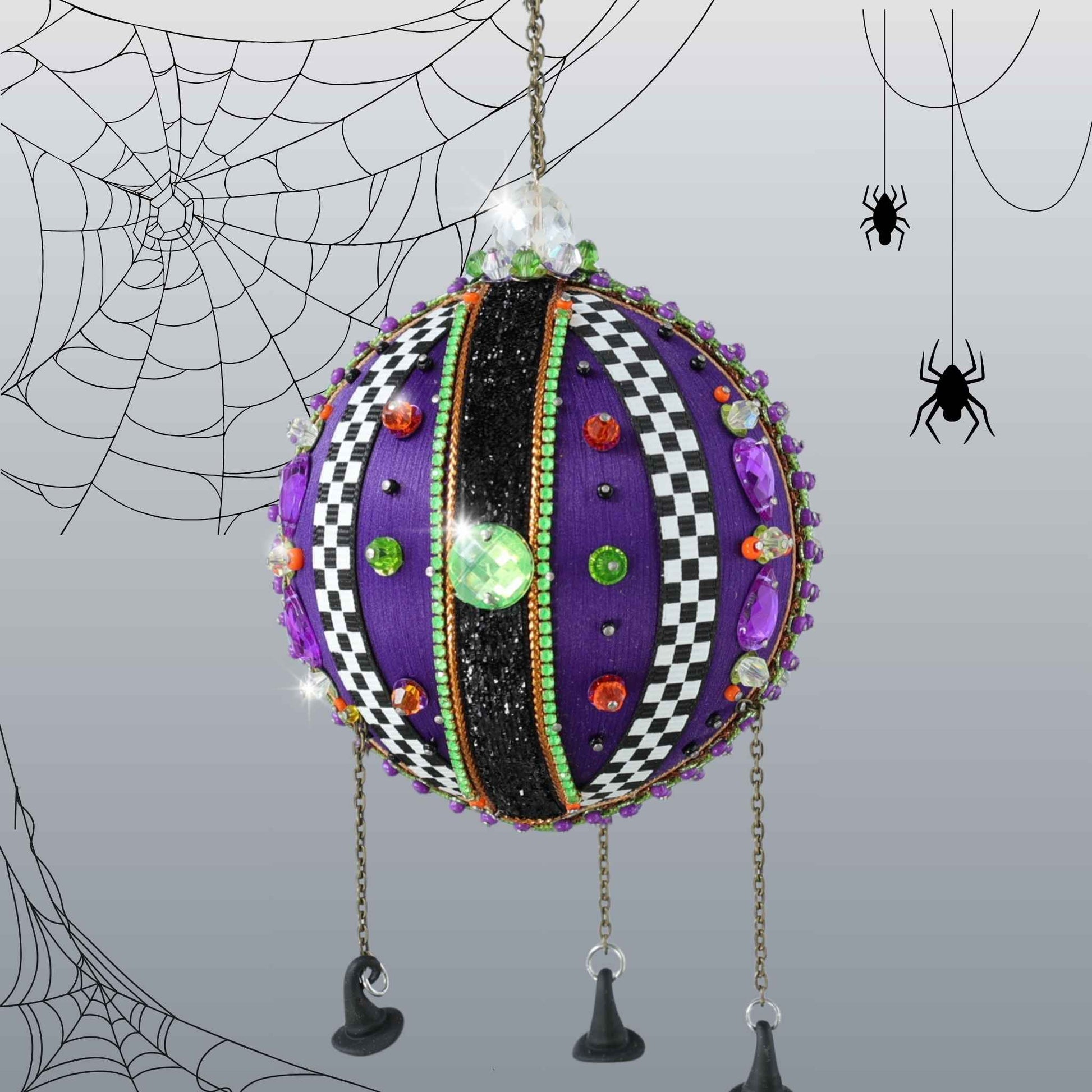 Handmade beaded purple halloween ornament with colorful embellishments and miniature witch hat charms by Whim5seasons.