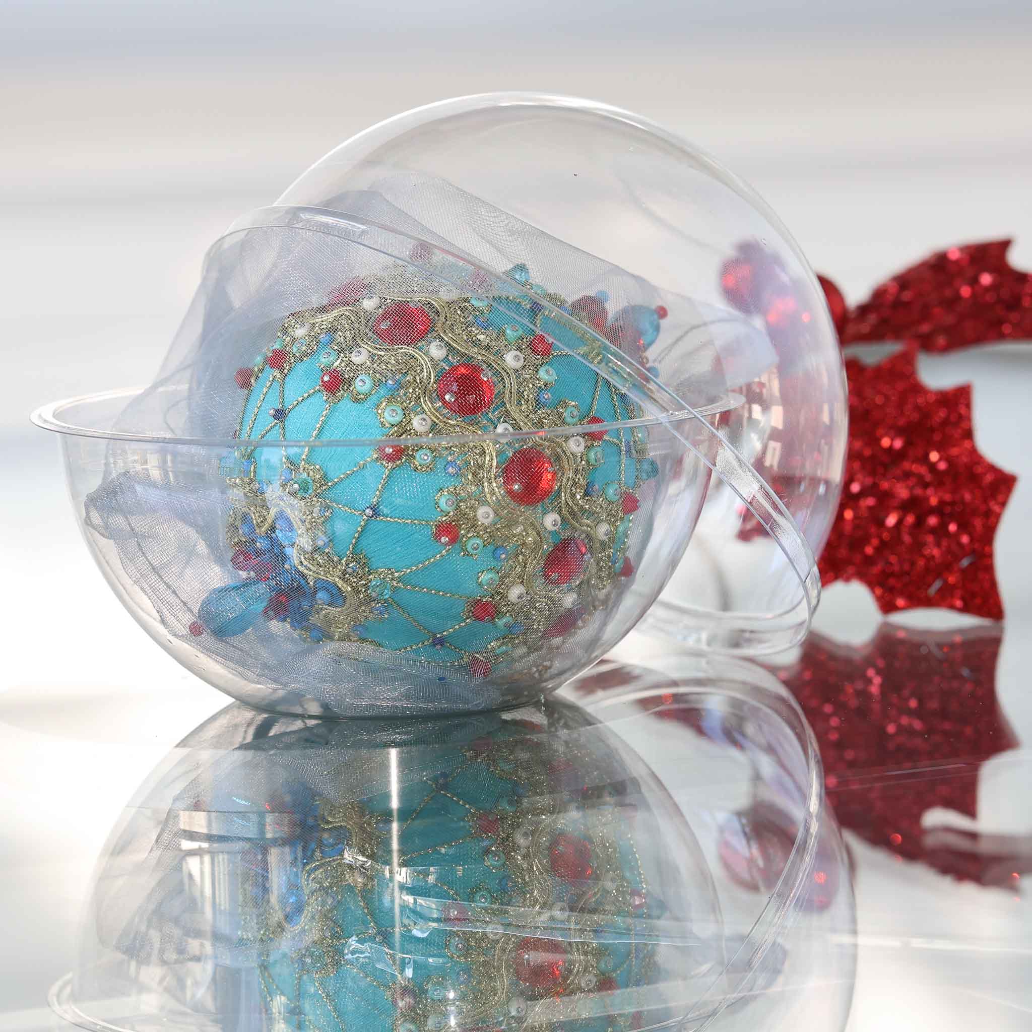 Christmas handmade push pin ornament in a handy clear round container for storage on a light gray background with a red decoration.(LightSeaGreen)