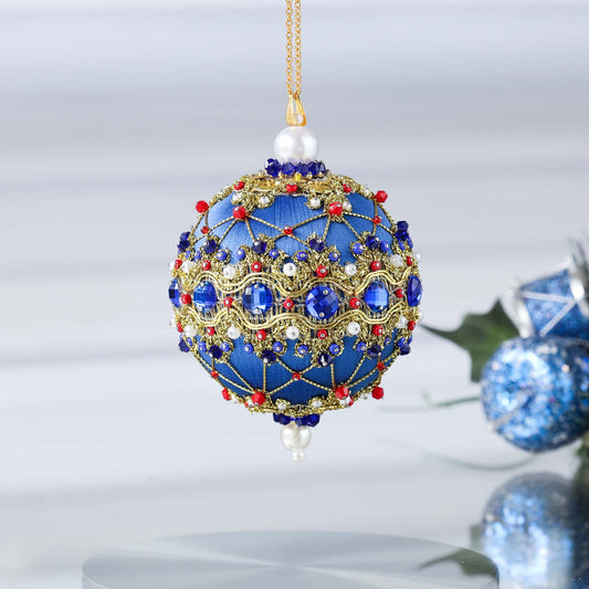 Handmade push pin ornament hanging on a gold chain. Festive blue satin foam ball with indigo rhinestones, sparkling gold trim, sequins, red bicone beads, and metallic cord. (Dark Slate Blue)
