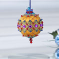 Load image into Gallery viewer, Gold colored handmade push pin ornament  hanging ona blue rhinestone chain - with purple rhinestones, sparkling gold trim, sequins, indigo rhinestone chain, and metallic cord. (Gold) 
