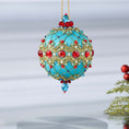 Load image into Gallery viewer, Hanging on a gold chain is a handmade push pin ornament - the color is light sea green, embellished with red rhinestones, red bicone beads, sequins, and metallic cord. (Light Sea Green)
