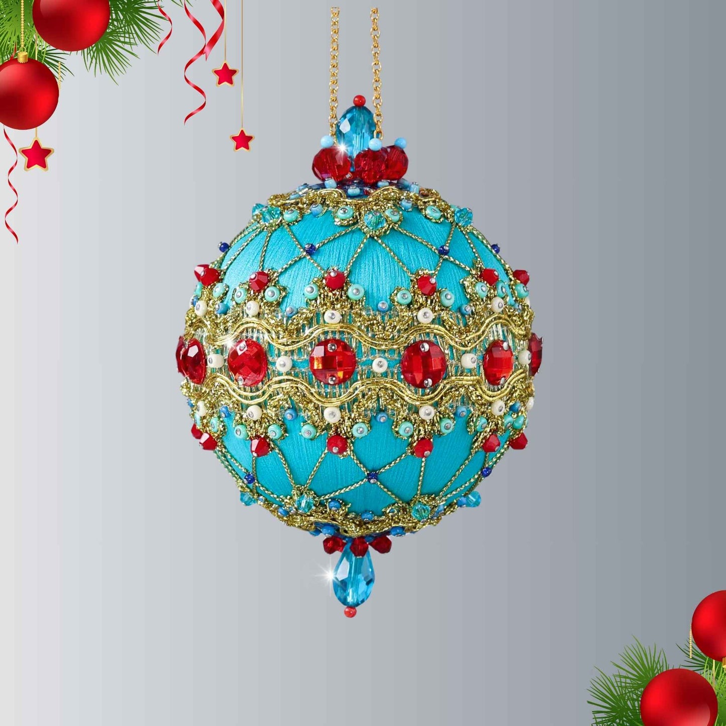 Hanging on a gold chain is a handmade push pin ornament - the color is light sea green, embellished with red rhinestones, red bicone beads, sequins, and metallic cord by Whim5seasons.