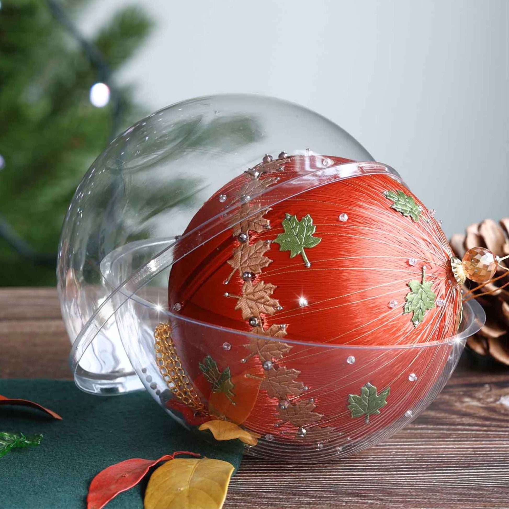 Finished satin bespoke Thanksgiving or Christmas ornament with maple leaf charms and trims  in a clear storage container by Whim5seasons.