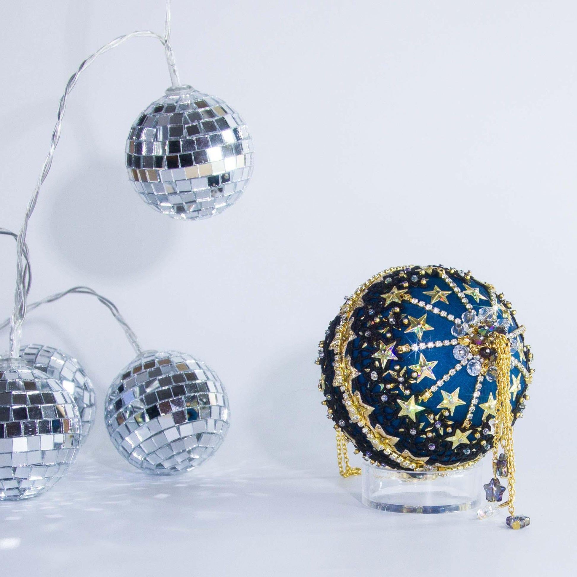A close view of the bottom detail of New Year Star Ornament from Whim5seasons showcasing sparkling rhinestones and crystal beads. (Dark Slate Blue)