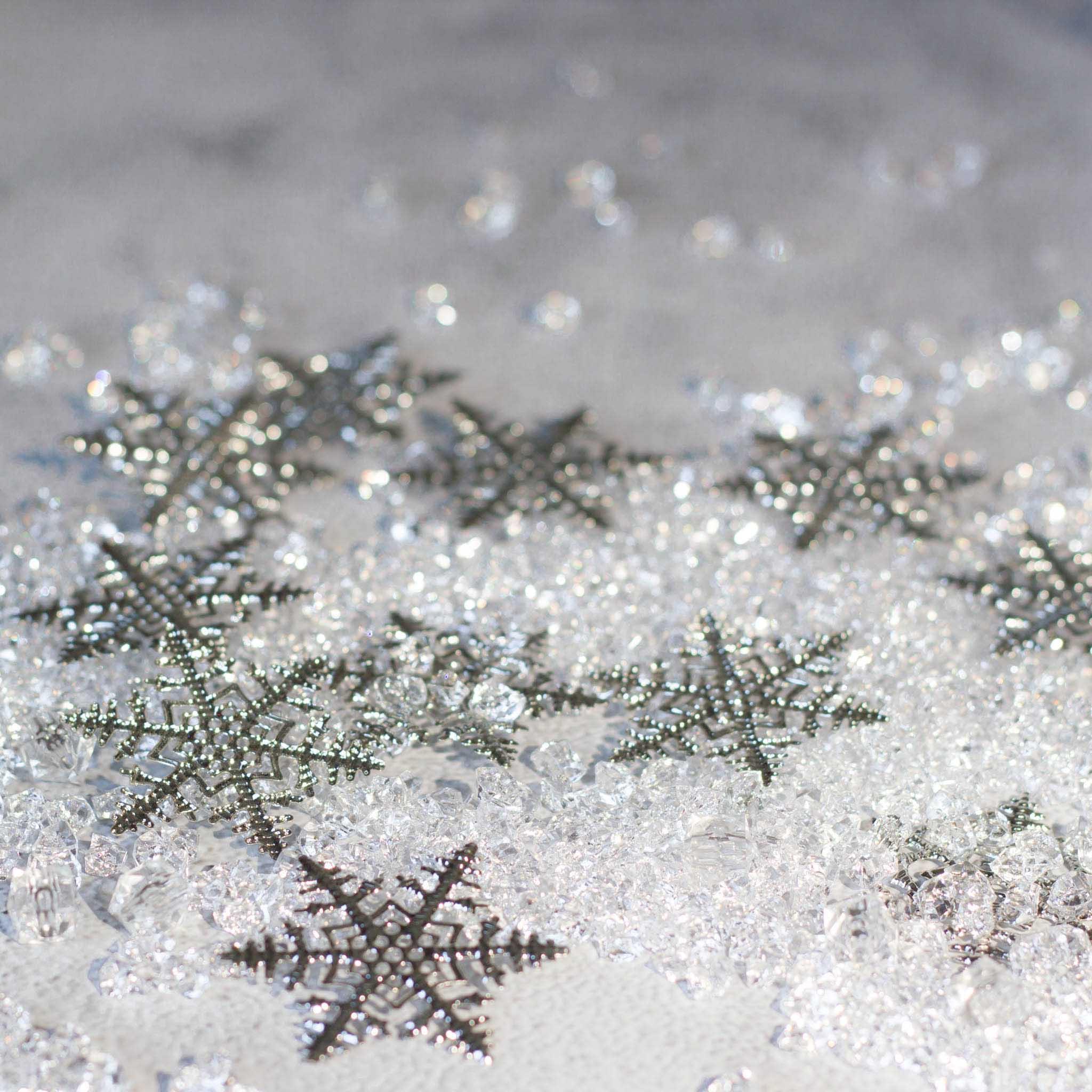 Christmas Craft Supplies: Close-up of six intricate silver snowflake filigree metal stampings - Whim5season