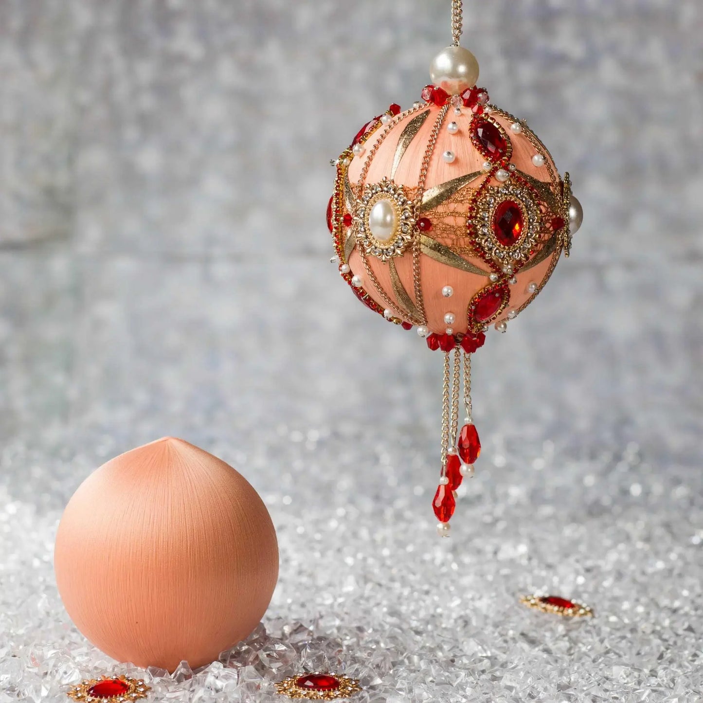 Phoenix Christmas Beaded Push Pin Satin Ornament Kit features large cameos with red rhinestones, gold alloy accents, and gold chain. (Coral)